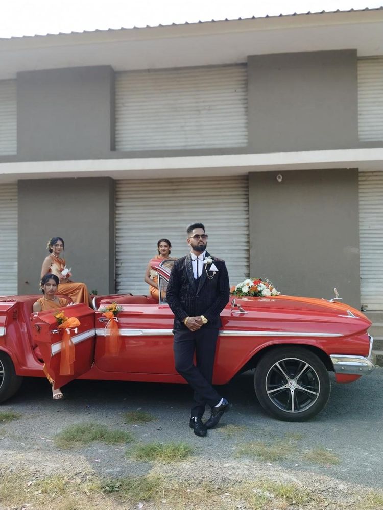 Groom and bridesmaids with the red Impala