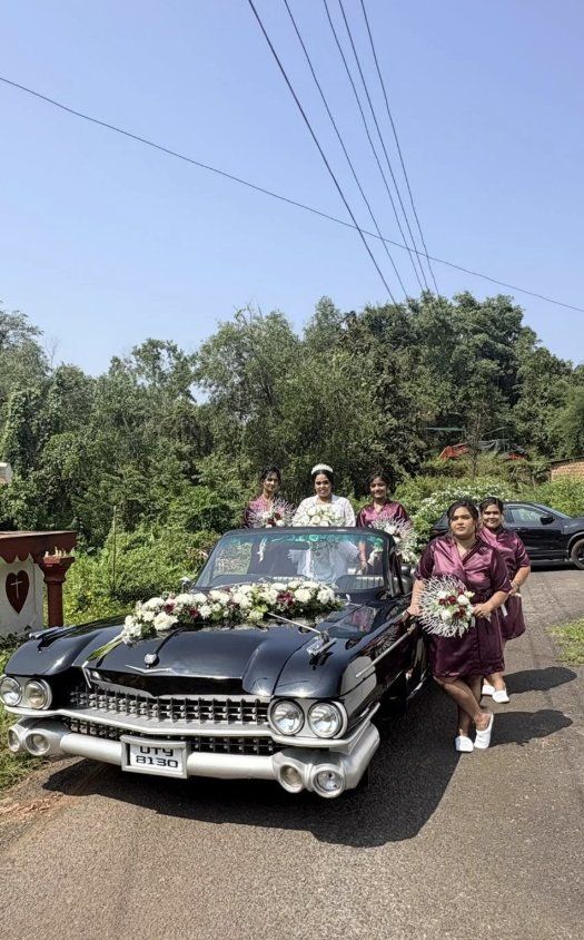 Bride and bridesmaids with the black Cadillac